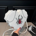 White heart-shaped crossbody bag featuring a rhinestone spider and cobweb stitching - White Spider
