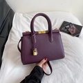 Elegant deep purple handbag with golden padlock charm and adjustable shoulder strap - Purple