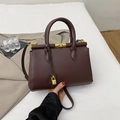 Deep brown leather handbag with gold twist lock and dual top handles for workwear - Brown