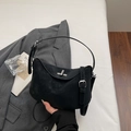 Minimalist black matte crossbody bag with silver twist lock on a neutral background - Black