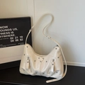 Creamy white hobo bag with silver studs and double zippers in a minimalist style - Off White