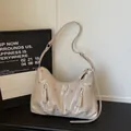 Chic cream leather shoulder bag with silver studs and iconic triangle plaque detail - Khaki