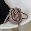 Chic dusty pink drawstring bucket bag with THE BUCKET print and golden metal details - Purple