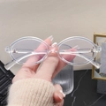 Detail view of transparent oval glasses frame showing model 75553 on the temple arm - Anti-blue Light Lens / Clear White