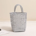 Silver woven tote bag with a modern metallic finish and spacious beach basket structure - Silver
