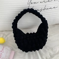 Handmade black crochet bubble texture handbag in a minimalist crescent shape design - Black