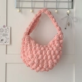 Pink chunky knit popcorn stitch handbag with a minimalist top handle for beach vacation - Pink