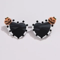Close-up of heart-shaped sunglasses with orange pumpkins and black stud accents - White Frame Grey Lens - Pumpkin Style