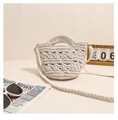 Detail of white handmade crochet texture and bohemian woven strap on a beach bag - Off White
