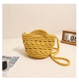 Detail of handcrafted yellow woven cotton crossbody bag with intricate hollow knit pattern - Yellow
