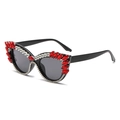 Cat eye sunglasses with black frame and red marquise rhinestones on white background - Red Diamond (C06)