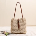 Handmade beige crochet tote bag featuring brown leather handles and tassel wood bead detail - Beige