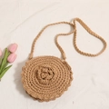 Bolso bandolera redondo de ganchillo caqui hecho a mano con motivo floral para la playa - Caqui
