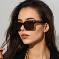 Vintage tortoiseshell square sunglasses with dark lenses on a fashion model face - Leopard Print