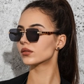 Modern rimless square sunglasses with grey lenses and leopard pattern temples on model - C02 Black