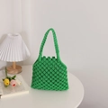 Green handmade woven cotton rope bag featuring hollow mesh pattern for summer beach use - Green