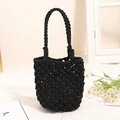 Handcrafted black crochet bucket bag with intricate woven hollow pattern and dual handles - Black