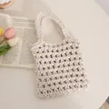 Handgefertigte gewebte Netztasche in Cremeweiß mit elegantem, hohlem Häkeldesign - Weiß