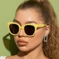 Close-up of yellow acetate sunglasses and silver geometric earrings on a model - Yellow Frame Full Tea Lens
