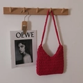 Handmade magenta woven cotton shoulder bag with crochet texture and minimalist U-shape - Rose Red