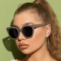 Trendy large-frame cat-eye sunglasses with translucent grey frames and dark black lenses - Grey Frame Grey Lens