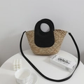 Handcrafted straw tote with black leather handles and shoulder strap for summer travel - Black