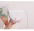 Close-up of woven straw bag with pink and white contrast and large pearl detail - Green + Pink Contrast Color (Contrast Pearl Flap)