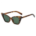 Fashionable cat eye sunglasses with tortoise frame and dark green lenses in side view - Leopard Print