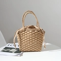 Handwoven straw tote bag with drawstring lining and sturdy handles for summer beach vacations - Brown