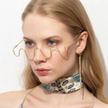 Detail of wavy gold metal half-frame glasses and sparkling long rhinestone tassel earrings - Shiny Gold Style (C01)