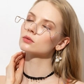 Close-up of wavy metal eyewear frame with colorful rhinestones on fashion model - Silver Rhinestone Style (C04)