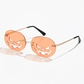 Halloween pumpkin sunglasses with orange frameless jack-o'-lantern cutout lenses and gold metal arms - Orange
