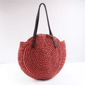 Handmade circular woven straw tote bag in brick red with black faux leather shoulder straps - Brick Red