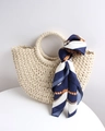 Handmade cream semi-circle straw bag with navy patterned silk scarf on the handle - Off-white + Carriage Blue Scarf