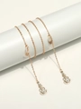 Catena per occhiali dorata con ciondoli chitarra, perle bianche e strass - Oro