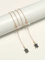 Golden eyewear chain with leopard print turtle charms on a white display stand - Default