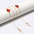 Catenina per occhiali dorata con cristalli rossi su espositore bianco per occhiali da sole - Catena d'oro con cristalli tondi rossi