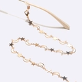 Golden eyewear chain with star and moon charms featuring silicone non-slip loops - Gold