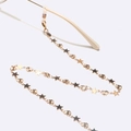 Golden eyewear chain with star and moon charms on a white background with sunglasses - Gold