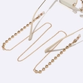 Golden handmade glasses chain featuring delicate metal links and stylish star charms - Gold