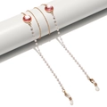 Elegante catenella per occhiali dorata con perle bianche e cristalli rosa su supporto - Rosa