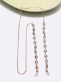 Catena per occhiali in metallo dorato con strass trasparenti e perle su fondo bianco - Oro
