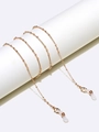 Elegant gold metal eyeglass chain with fine beads on a white minimalist display stand - Gold
