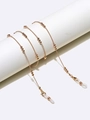 Gouden kralen brilketting met antislip siliconen lussen op witte cilindersteun - Goud