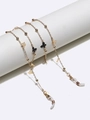 Elegant gold glasses chain with metal beads and butterfly charms on a white display - Gold