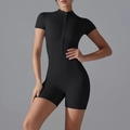 Close-up of black short sleeve yoga jumpsuit featuring front zipper and stand collar detail - S / Black