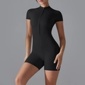 Detail of black slim fit yoga bodysuit featuring a stand collar and front zipper closure - S / Black