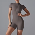 Detail view of the half-zip collar and short sleeve design on dark brown yoga bodysuit - S / Khaki Brown