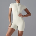 Close-up of the front half-zipper and stand collar on a slim-fit athletic bodysuit - S / Light Ivory