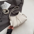 Minimalist creamy white lychee grain leather shoulder bag with decorative tassels and straps - White